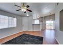 A spacious living room boasts ample natural light, wood floors, and neutral walls at 1881 W Alexander Rd # 2079, North Las Vegas, NV 89032