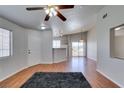 A spacious living room boasts ample natural light, wood floors, and neutral walls at 1881 W Alexander Rd # 2079, North Las Vegas, NV 89032