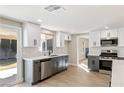 Updated kitchen with modern cabinets, stainless steel appliances and sliding door access to the backyard at 1943 Hallwood Dr, Las Vegas, NV 89119
