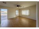 Spacious living room with hardwood floors and ample natural light, perfect for relaxing or entertaining at 211 Kansas Ave, Henderson, NV 89015