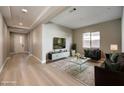 Bright living room with light floors, modern furniture, and recessed lighting at 2194 Pigeon Hawk St, Las Vegas, NV 89138