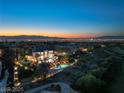 A stunning aerial view showcasing the estate's pool, landscaping, and the breathtaking Las Vegas skyline in the distance at 22 Anthem Pointe Ct, Henderson, NV 89052