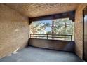 The cozy balcony has textured walls with a lovely view of the trees and grounds at 2200 S Fort Apache Rd # 2049, Las Vegas, NV 89117
