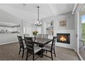 Charming dining room featuring a cozy fireplace and stylish light fixture, perfect for memorable gatherings at 2325 Windmill Pkwy # 1124, Henderson, NV 89074