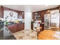 Cozy kitchen features tile flooring, stainless steel appliances, and stylish cabinetry at 304 S Crestline Dr, Las Vegas, NV 89107