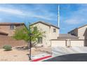 Charming home featuring a three-car garage, complemented by a xeriscaped front yard with a beautiful tree at 4014 Sparrow Rock St, Las Vegas, NV 89129