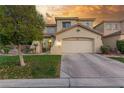 Charming two-story home with a well-maintained lawn, mature trees, and a two-car garage at 4573 Milvio Ave, Las Vegas, NV 89141