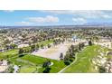 Scenic aerial view showcases the community's golf course and its tranquil neighborhood at 5329 La Patera Ln, Las Vegas, NV 89149