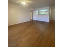 Bright living room featuring hardwood floors and an opening to the kitchen at 555 E Silverado Ranch Blvd # 1069, Las Vegas, NV 89183