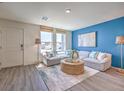 Inviting living room with large windows, comfortable seating, and contemporary decor creating a relaxing atmosphere at 6112 Aster Garden St # 131, North Las Vegas, NV 89081