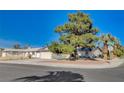 Street view of home on a corner lot with mature landscaping and ample parking at 804 S Mallard St, Las Vegas, NV 89107