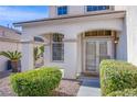 Welcoming front entrance with arched columns, decorative shrubs, and a glass-paneled door at 8321 Gorsky Ave, Las Vegas, NV 89131