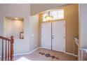 Bright foyer featuring double doors, tile flooring, and an alcove perfect for displaying decorations at 8321 Gorsky Ave, Las Vegas, NV 89131