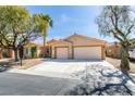 Attractive single-story home featuring a spacious driveway and a two-car garage at 8404 Dripping Rock Ct, Las Vegas, NV 89131