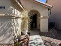 Inviting front entrance with a covered porch and well-manicured landscaping at 8616 Hidden Pines Ave, Las Vegas, NV 89143