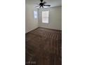Bedroom with neutral walls, soft carpet, and natural light from the window at 8626 Anderson Dale Ave, Las Vegas, NV 89178