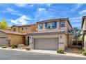 Charming two-story home with a two-car garage, desert landscaping, and a tile roof at 8626 Anderson Dale Ave, Las Vegas, NV 89178