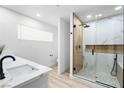 Elegant bathroom with a glass-enclosed shower, modern fixtures, and bright lighting at 1020 Baker Ave, Las Vegas, NV 89108