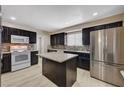 Updated kitchen with modern appliances, granite countertops, and dark wood cabinetry at 108 Prince Ln, Las Vegas, NV 89110