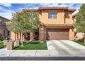 Lovely two-story home showcasing a manicured front yard and inviting entrance at 1272 Olivia Pkwy, Henderson, NV 89011