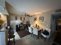 Open concept dining area is highlighted by neutral tones and ceiling fan at 1455 E Katie Ave # L23, Las Vegas, NV 89119