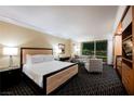 A stylish bedroom features a plush king bed, city views, and a sleek, modern design at 2000 N Fashion Show Dr # 4200, Las Vegas, NV 89109