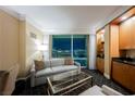 Cozy living area with sleeper sofa, floor-to-ceiling windows offering breathtaking city views at 2000 N Fashion Show Dr # 4200, Las Vegas, NV 89109