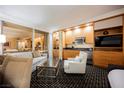 Charming living area with kitchenette, complete with modern appliances and city views at 2000 N Fashion Show Dr # 4200, Las Vegas, NV 89109