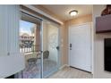 View of the cozy balcony with seating, accessible through sliding glass doors at 2120 Ramrod Ave # 513, Henderson, NV 89014