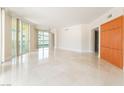 Bright living room featuring marble floors, neutral tones, and large windows for natural light at 2877 Paradise Rd # 1806, Las Vegas, NV 89109