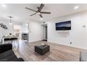 Open-concept living room with neutral tones and an adjacent dining area at 3120 S Eastern Ave # 5, Las Vegas, NV 89169