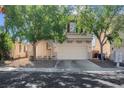 Charming home featuring a two-car garage, drought tolerant landscaping and covered entry at 3186 Lapis Beach Dr, Las Vegas, NV 89117