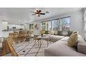 Bright living room featuring an open floor plan with wood floors and abundant natural light at 3217 Palladio Ave, North Las Vegas, NV 89031