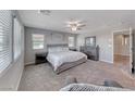 Serene main bedroom with neutral colors, plush carpeting, and abundant natural light at 358 Badinerie St, Henderson, NV 89011