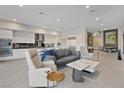 Open living area with sleek furniture, modern kitchen, and elegant decor at 36 Lakefront Dr, Henderson, NV 89011