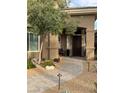 Inviting entrance featuring desert landscaping with a brick walkway at 512 Pima Canyon Ct, Las Vegas, NV 89144