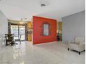 Open-concept living space featuring tile floors and dining area with a large window at 5463 Waltham Ln, Las Vegas, NV 89122