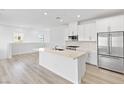 Bright, modern kitchen with stainless steel appliances and island at 600 N Carriage Hill Dr # 2098, Las Vegas, NV 89138