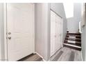 Bright entry with plank flooring, closet, and staircase at 6270 Dartington Hall St, Henderson, NV 89011