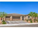 Charming single-story home with a three-car garage, desert landscaping and stone accents at 6280 Lamont Hills Ave, Las Vegas, NV 89139