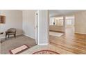Inviting entryway featuring a mix of carpet and hardwood flooring at 6417 Giant Oak St, North Las Vegas, NV 89084