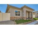 Charming single-story home features stucco siding, brick accents, neat landscaping and a cozy covered front porch entry at 759 Praire Plume St, Henderson, NV 89011