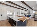 Bright kitchen boasts a spacious island with seating, modern appliances, and an open floor plan at 940 Viscanio Pl, Las Vegas, NV 89138