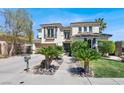 Inviting two-story home with landscaped front yard, mature trees, and meticulously maintained curb appeal at , Las Vegas, NV 89135