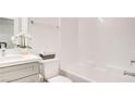 Bright bathroom featuring a bathtub, shower, and gray vanity at 1157 Blossom Point St, Las Vegas, NV 89135