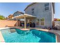 Backyard pool area with patio, perfect for relaxing and outdoor entertaining at 11739 Village Arbor St, Las Vegas, NV 89183