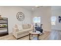 Inviting living room with comfortable seating, natural light, and contemporary decor at 1181 Blossom Point St, Las Vegas, NV 89135