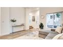 Bright living area with modern decor, hard flooring, and ample natural light from large window at 1187 Blossom Point St # 36, Las Vegas, NV 89135