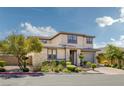 Beautiful two-story home featuring a neutral palette, manicured landscaping, and a paved driveway at 12311 Middle Creek St, Las Vegas, NV 89138