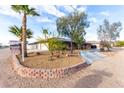 Inviting single-story home with solar panels, desert landscaping, and a spacious driveway at 1500 Tumbleweed Dr, Henderson, NV 89002